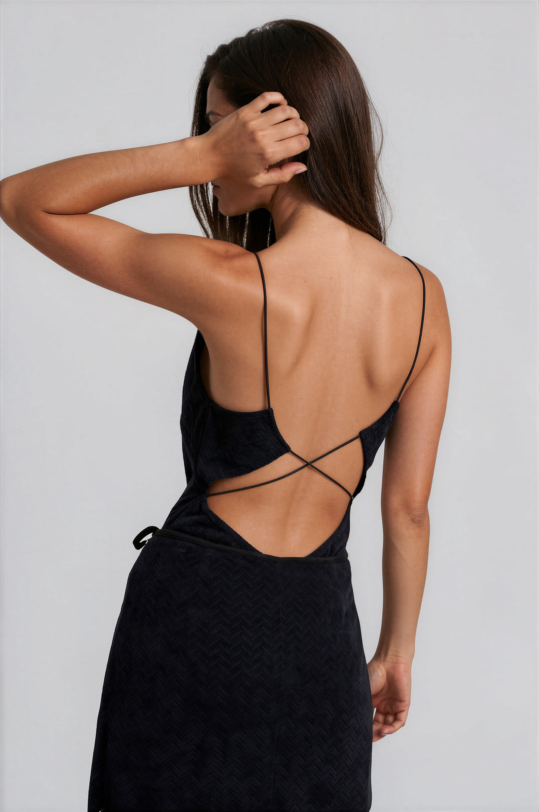 Woman wearing mint sleeveless mock neck sweater knit top