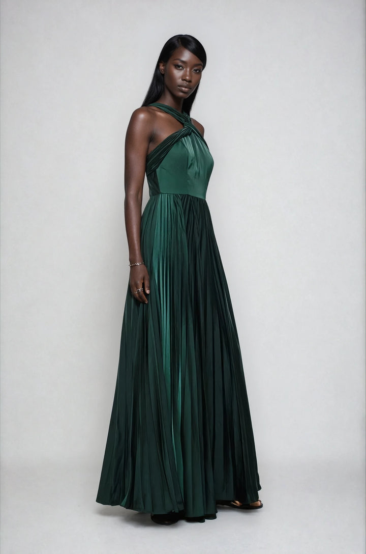Woman wearing a green evening gown against a white background