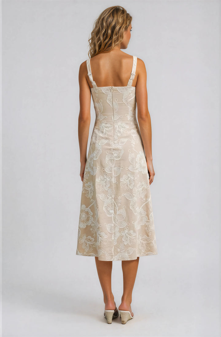 beige midi dress with white floral embroidery back view