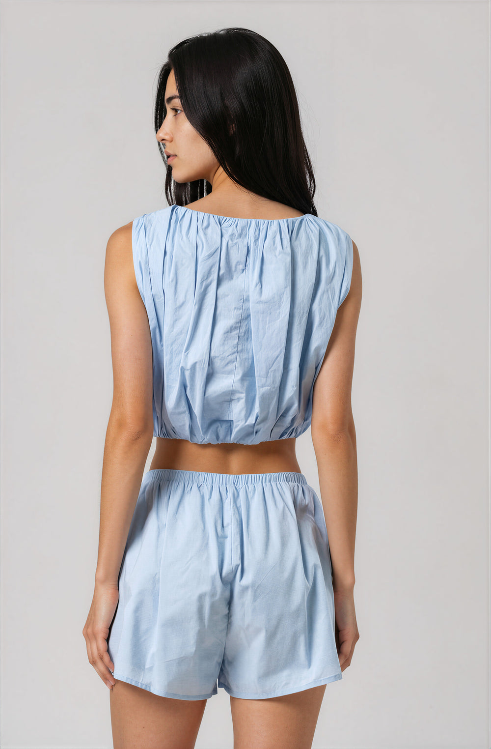 light blue cotton cropped sleeveless top for summer vacation back view