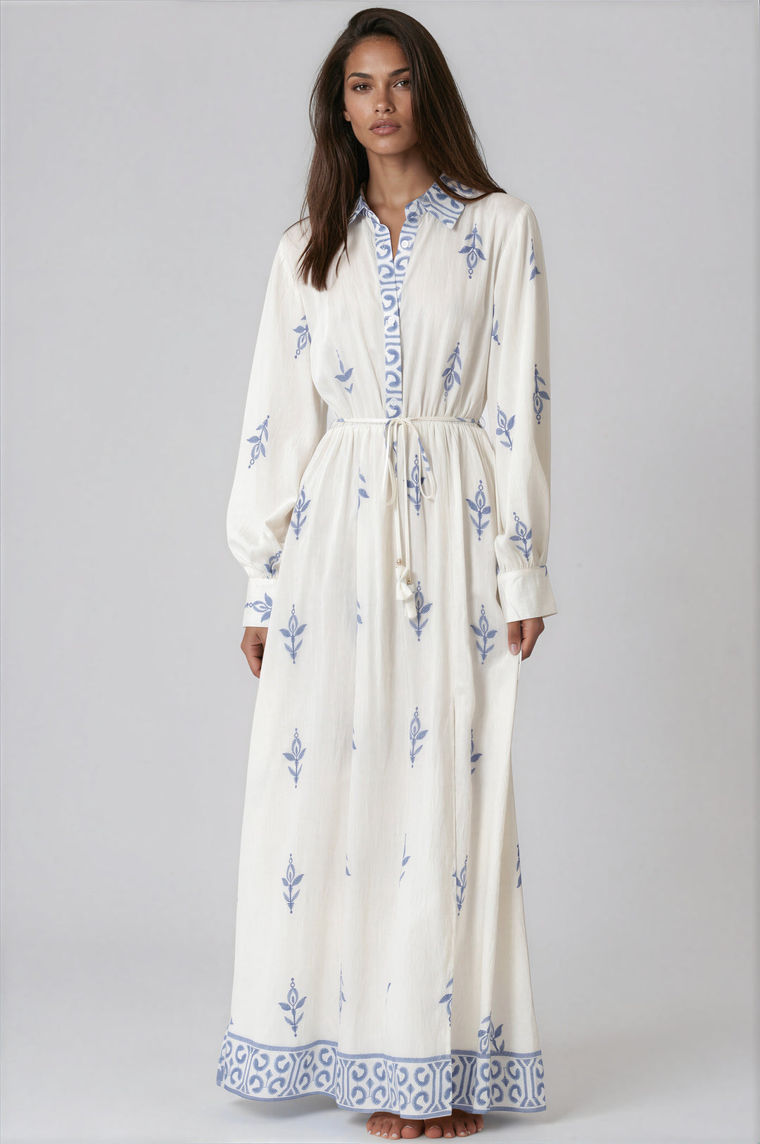 woman wearing ivory and blue long sleeve maxi dress