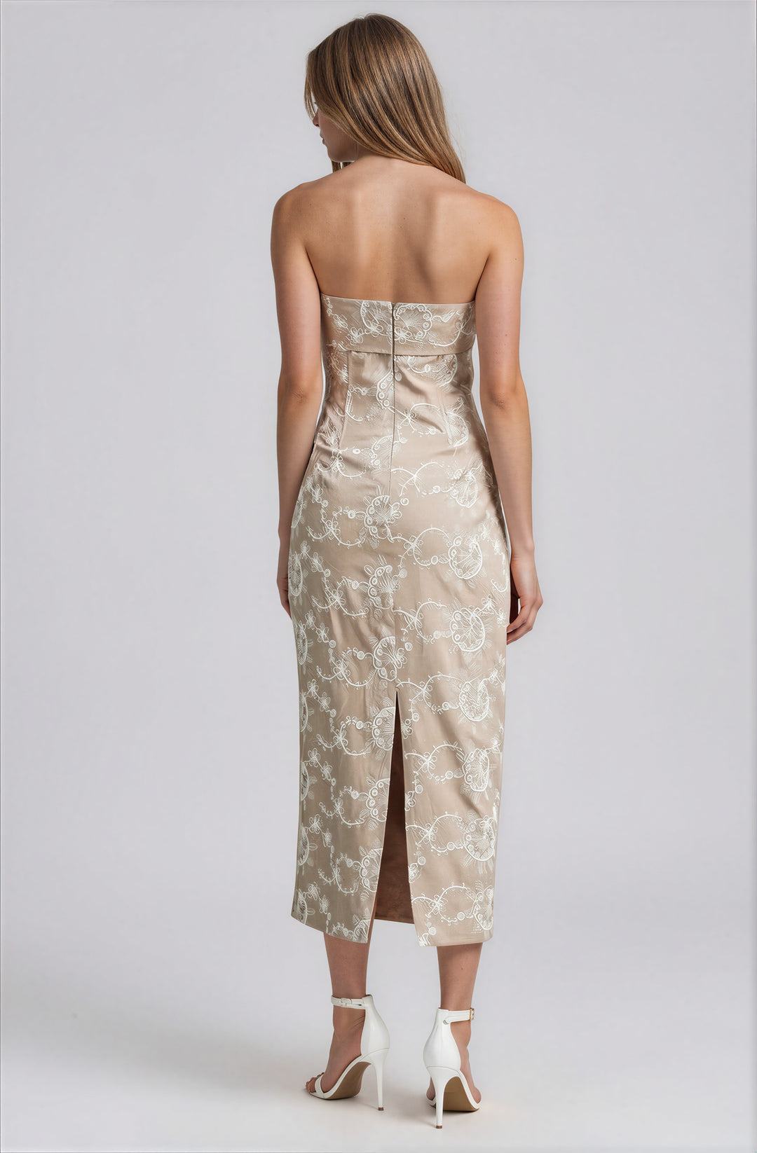 strapless beige midi dress with white embroidered pattern and back slit for weddings back view