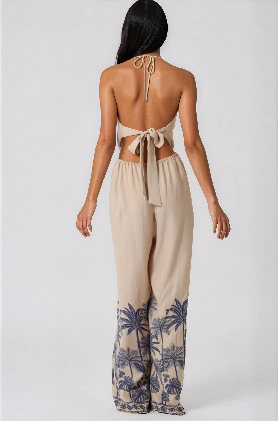 beige halter jumpsuit with palm tree print