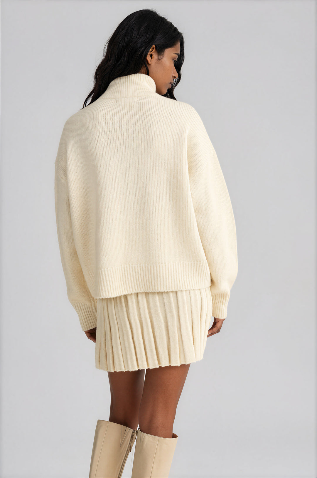 Cream pleated knit A-line mini skirt detail