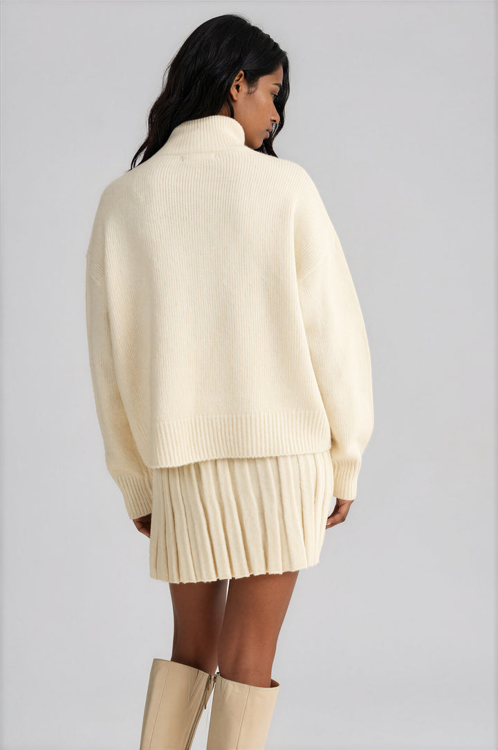 Cream pleated knit A-line mini skirt detail