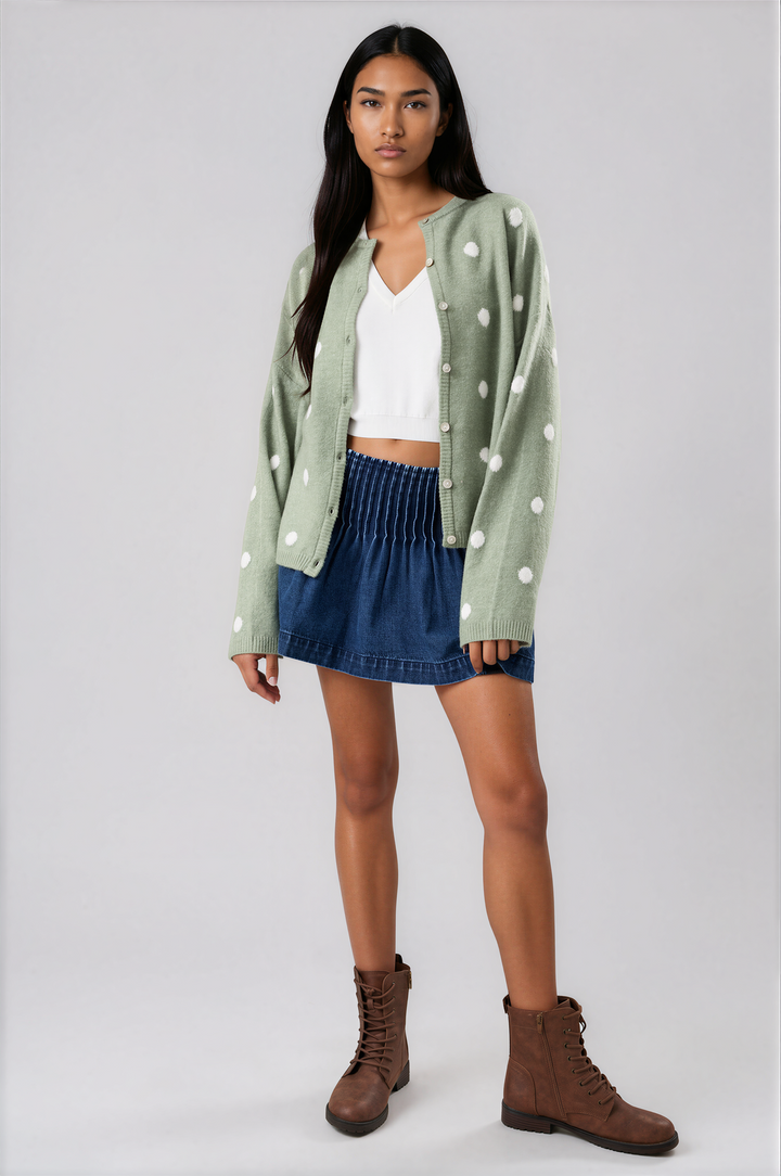 woman wearing sage green polka dot cardigan