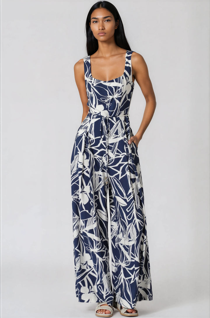 navy and white sleeveless jumpsuit with tropical pattern