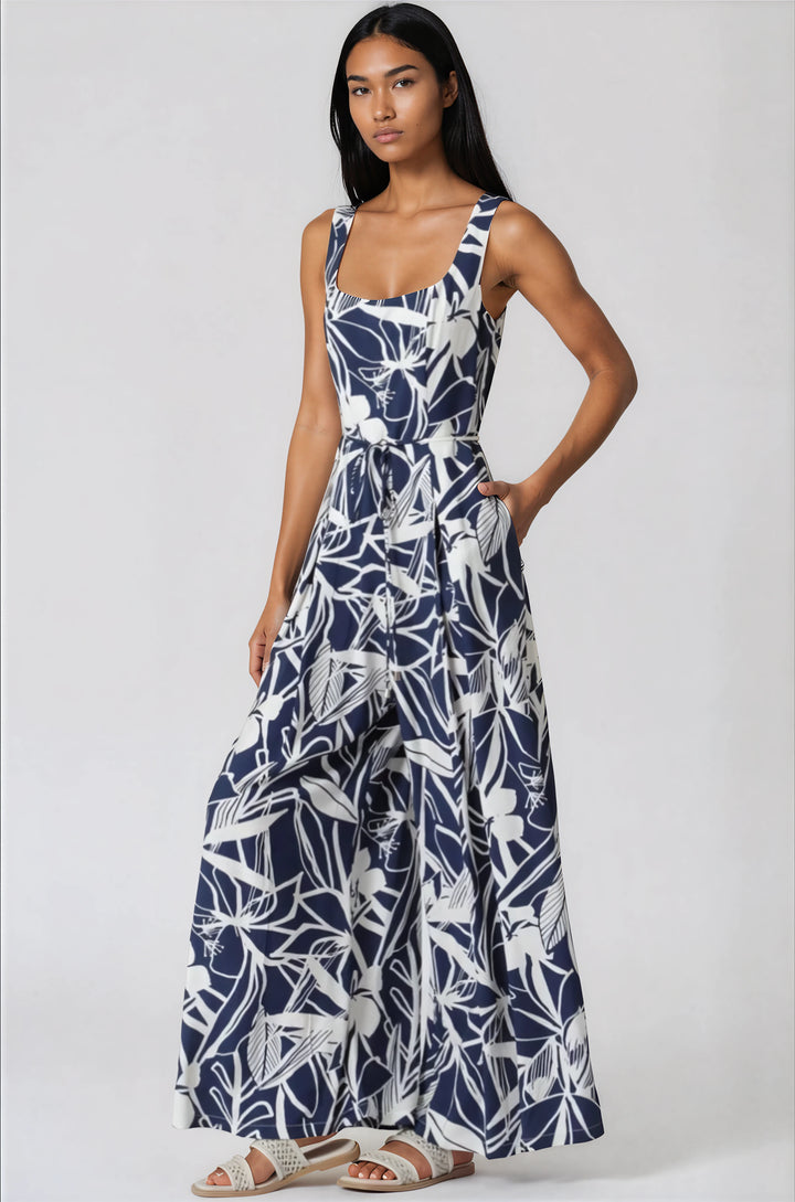 navy and white sleeveless jumpsuit with tropical pattern