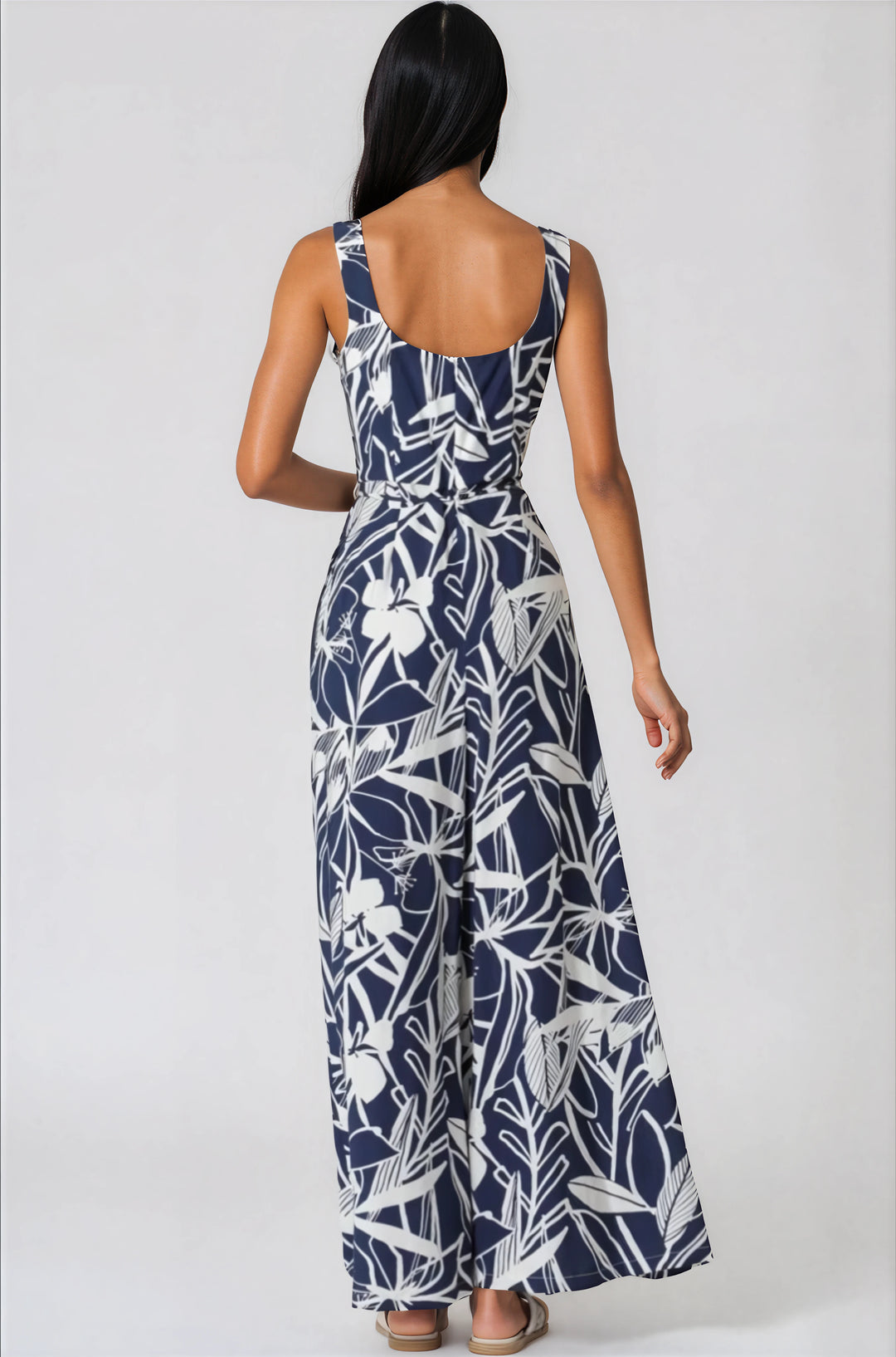 navy and white sleeveless jumpsuit with tropical pattern