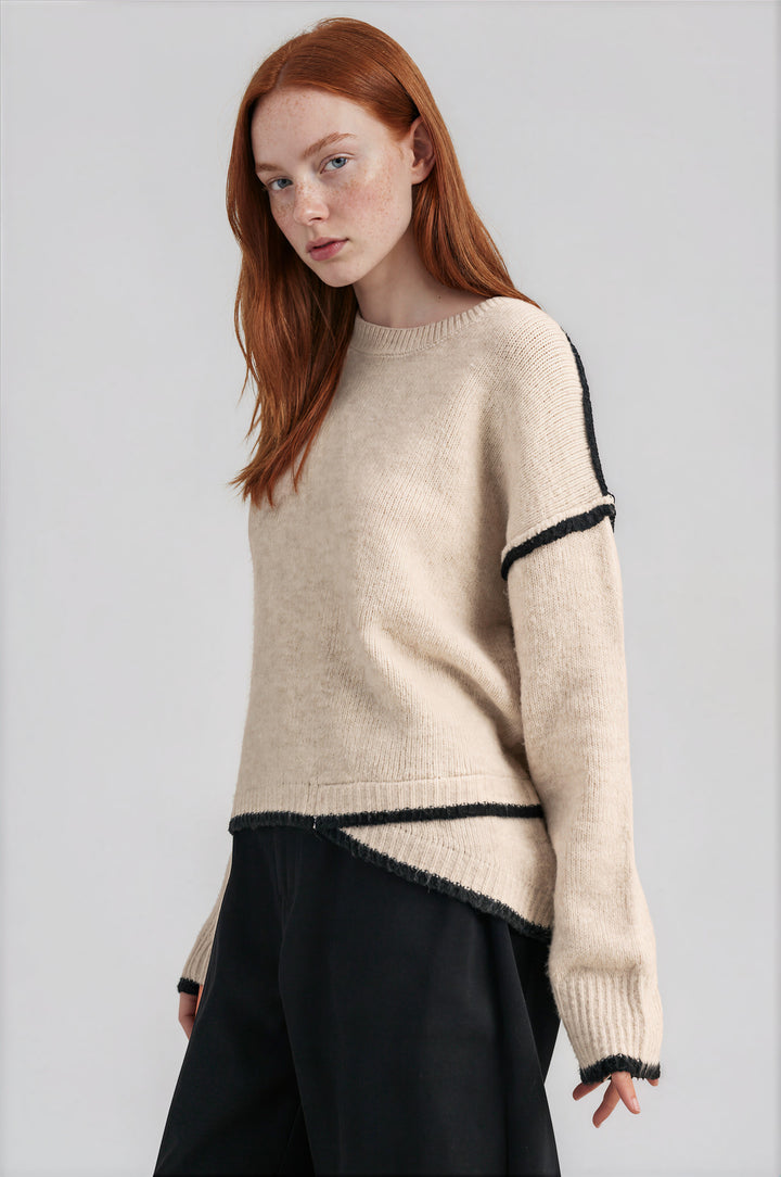 Cream contrast-trim knit sweater with a relaxed oversized fit