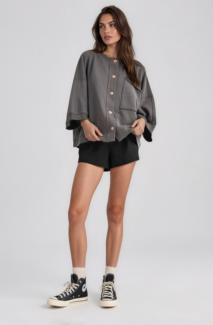 black shorts with elastic waistband and button detail