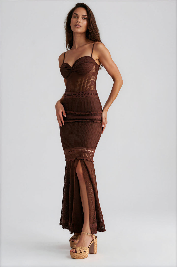 Woman wearing brown crochet knit maxi dress with sweetheart neckline and mermaid silhouette