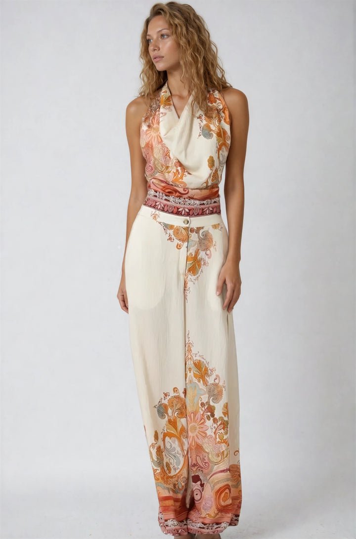 Woman wearing a floral patterned pant set on a white background