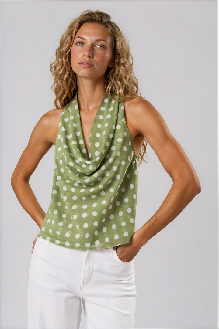 woman wearing sage green polka dot halter top