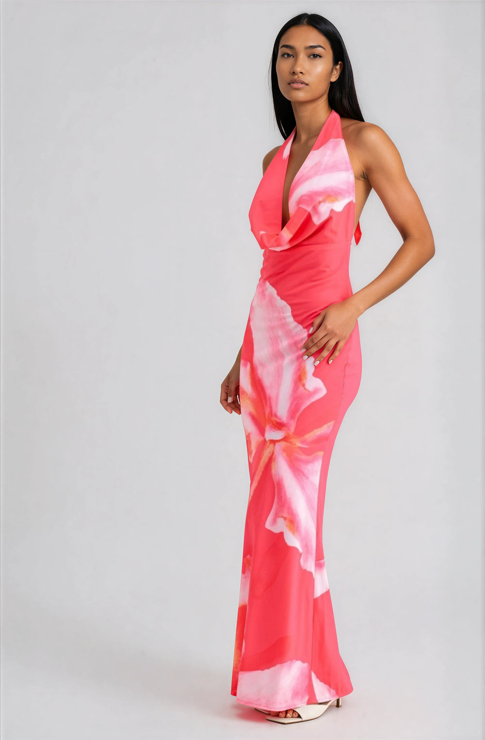 woman wearing pink floral halter maxi dress