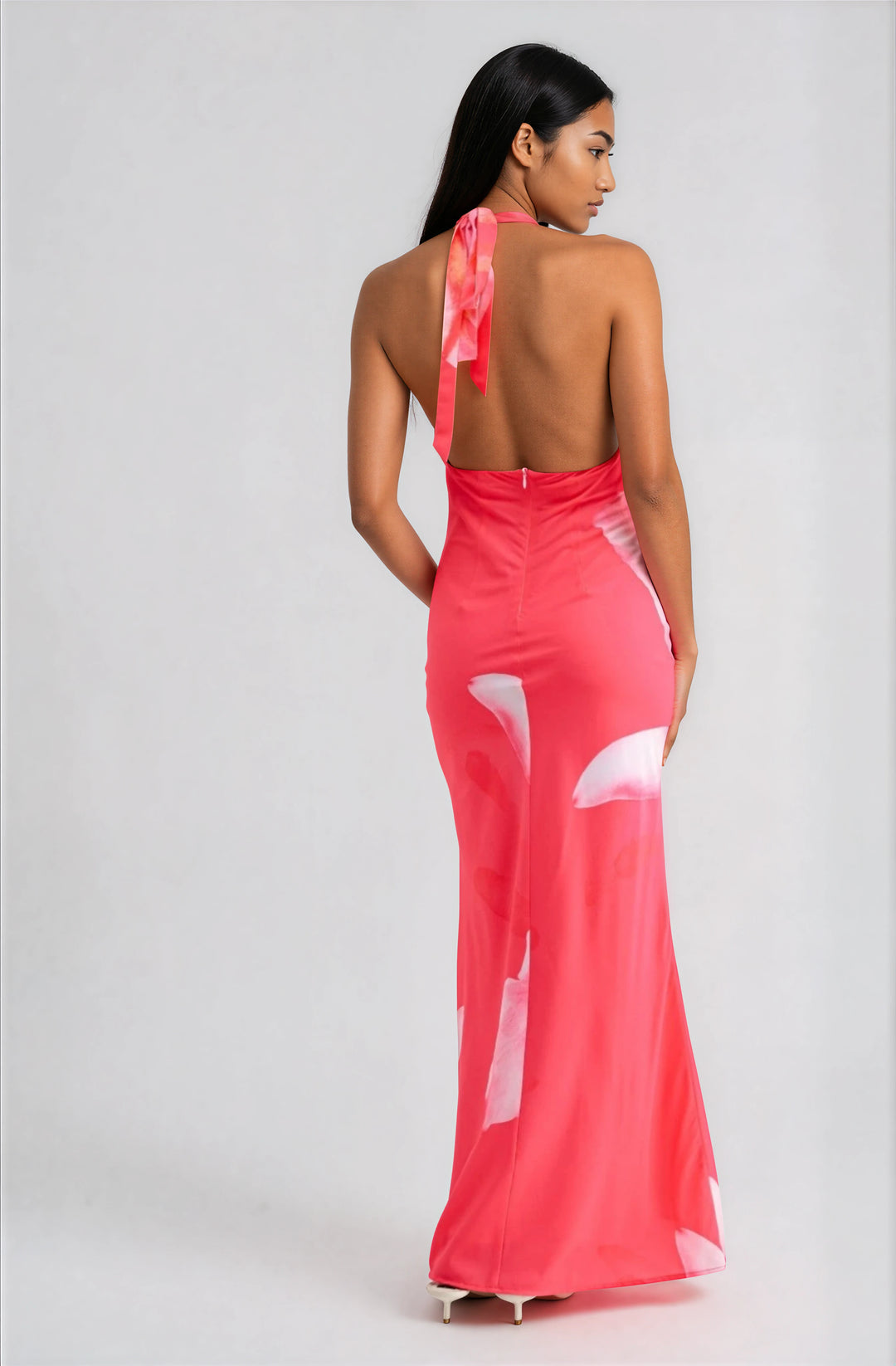 woman wearing pink floral halter maxi dress