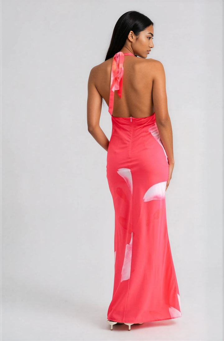 woman wearing pink floral halter maxi dress