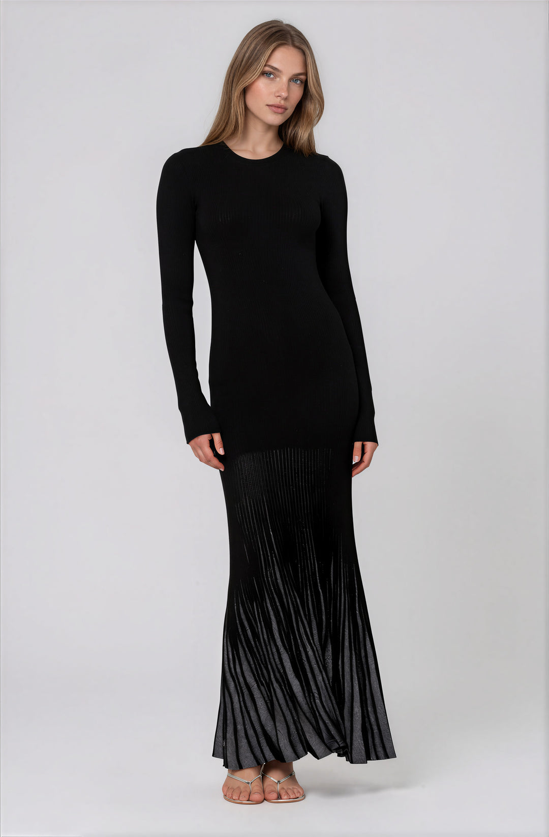 long sleeve black sweater maxi dress with silver pleated skirt detail