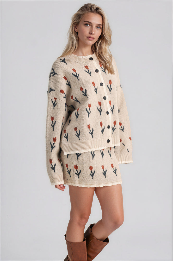Grey tulip-print cardigan with cream trim and a crew neckline