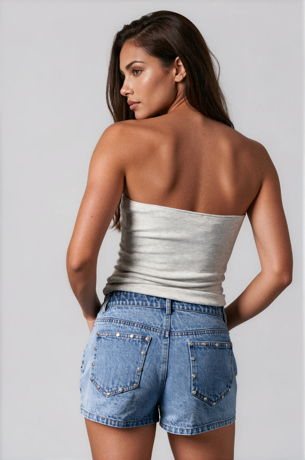 woman wearing gray tube top with USA lettering