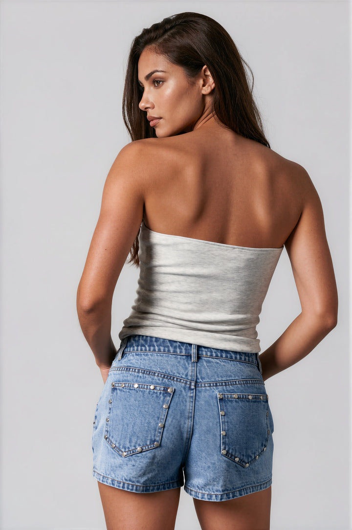 woman wearing gray tube top with USA lettering