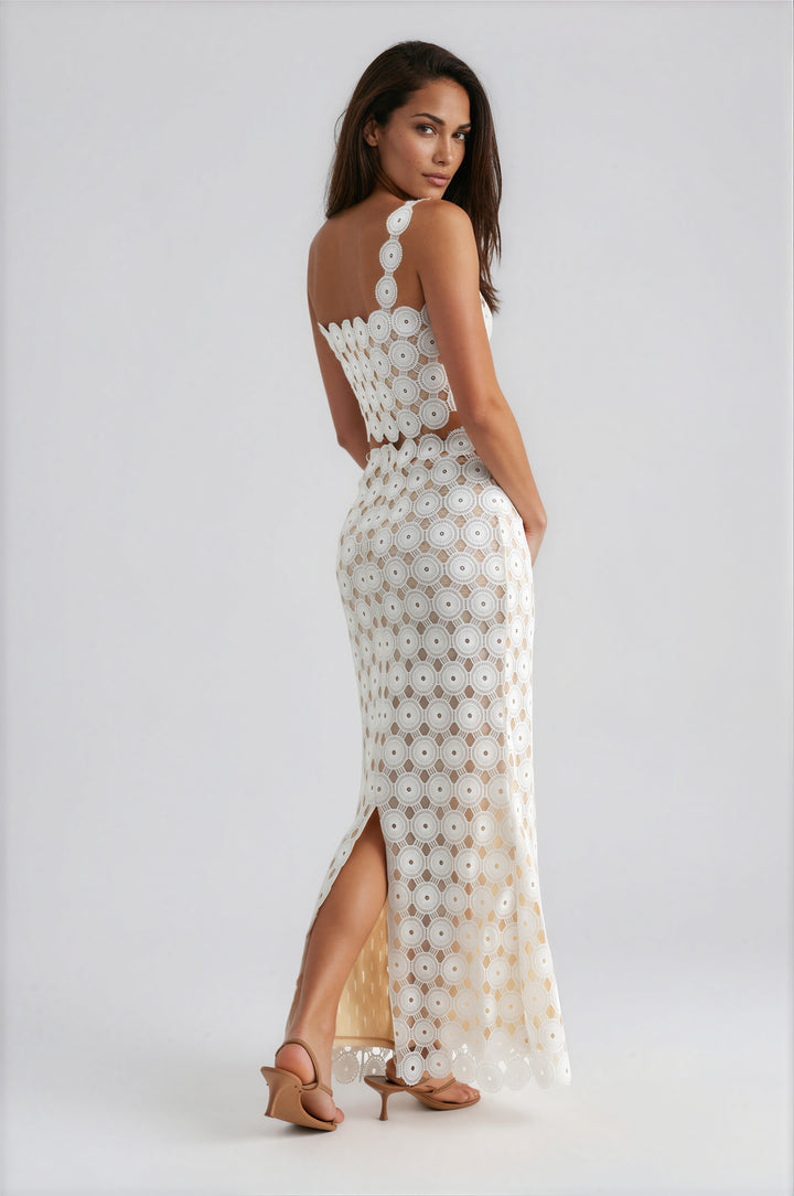 Back view of white crochet lace cropped tank and high-waisted maxi skirt set with side slit and scalloped hem