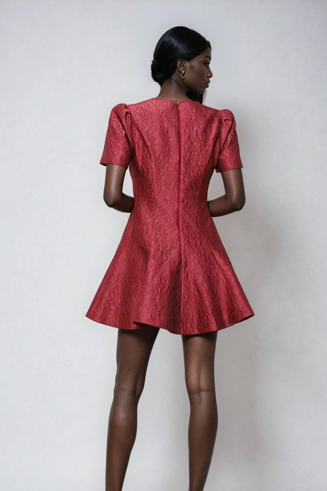 Back view wine mini dress with hidden zipper on model