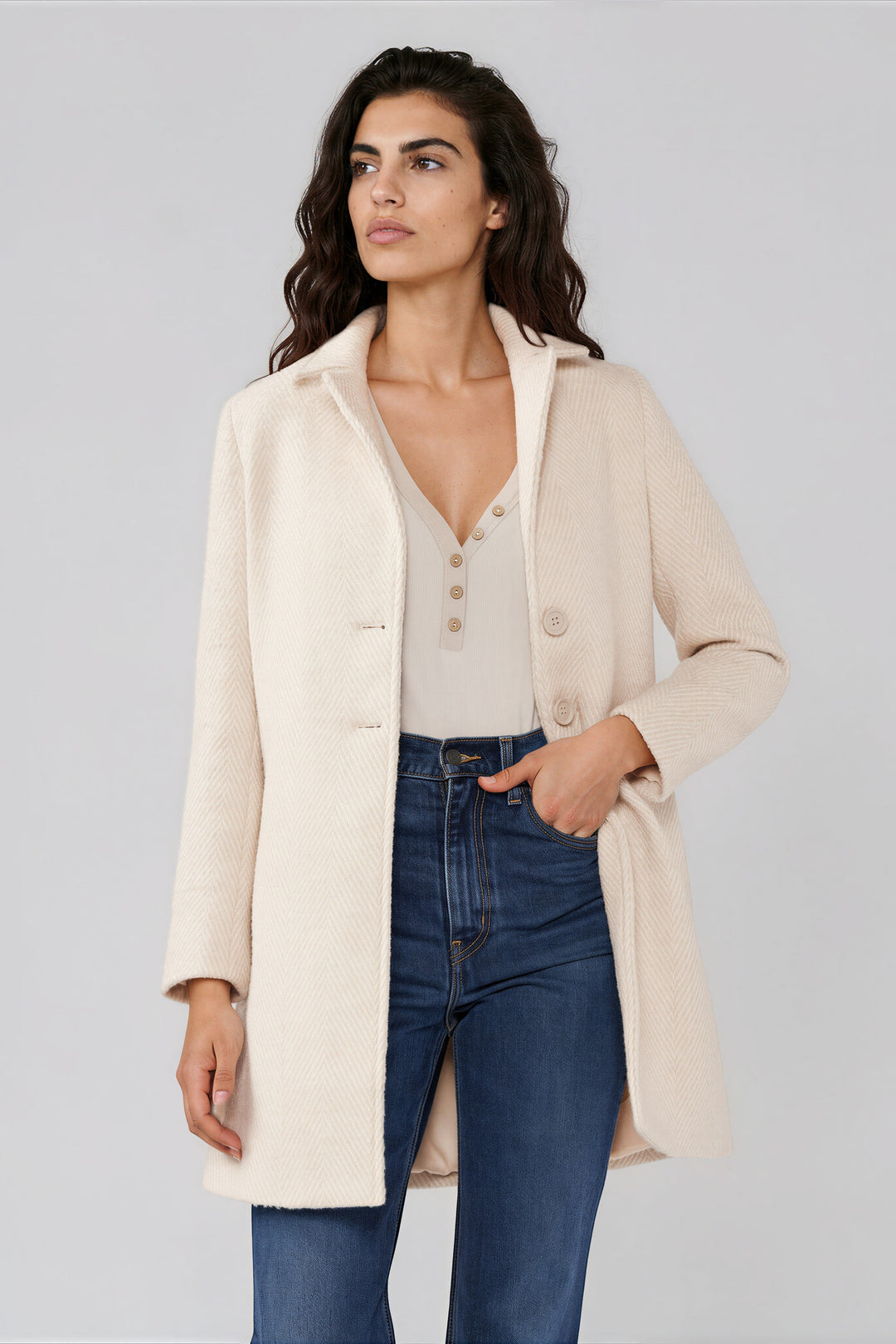 Cream chevron coat with a notched lapel and button front, front view