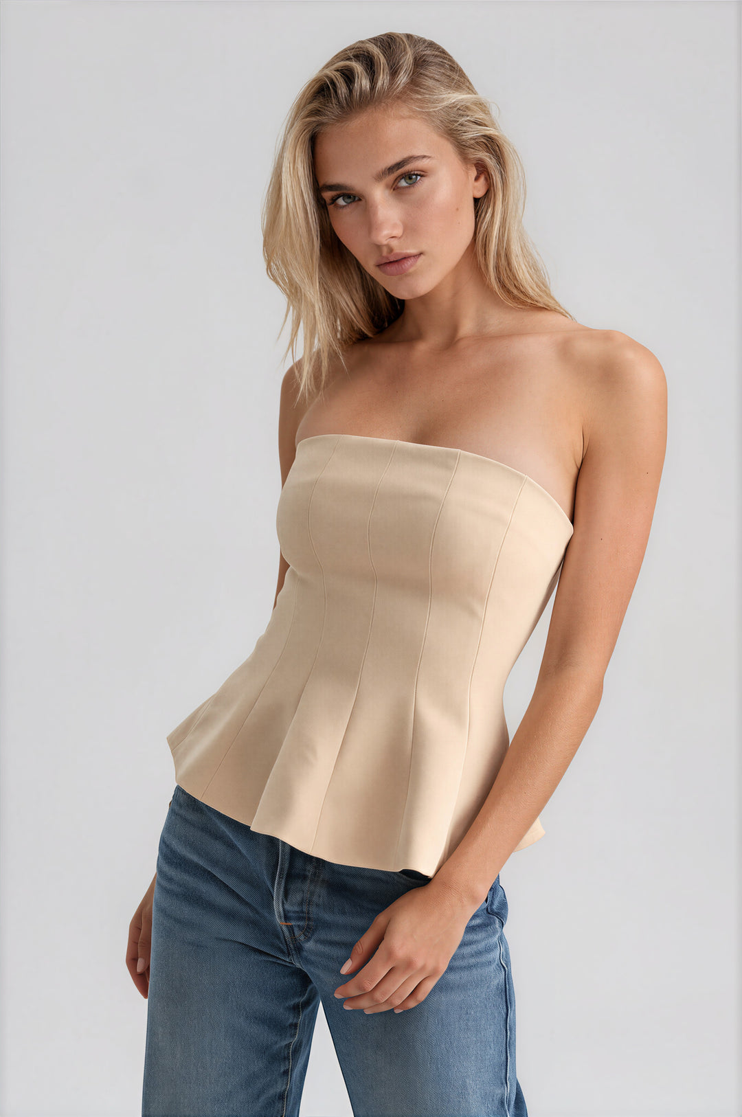 becca top front view in beige strapless peplum bustier