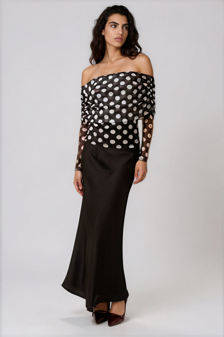 Black satin maxi skirt with high waisted fit on model