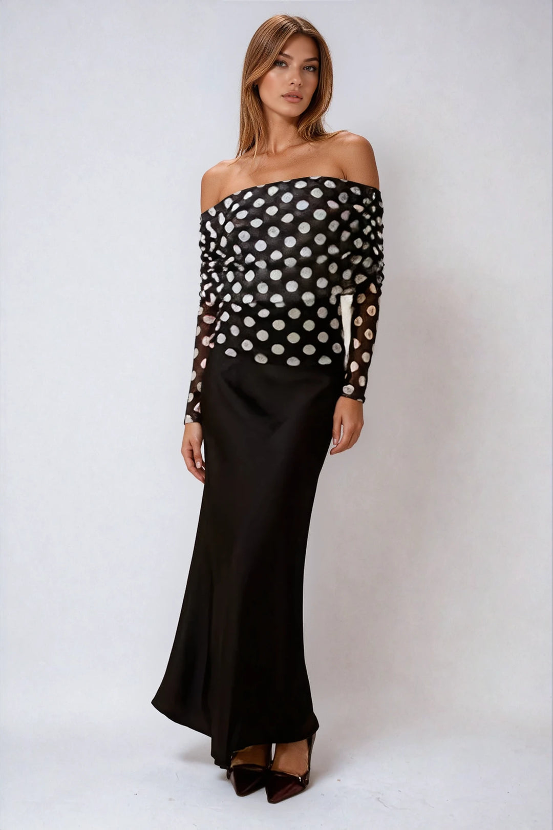 Black satin maxi skirt with high waisted fit on model