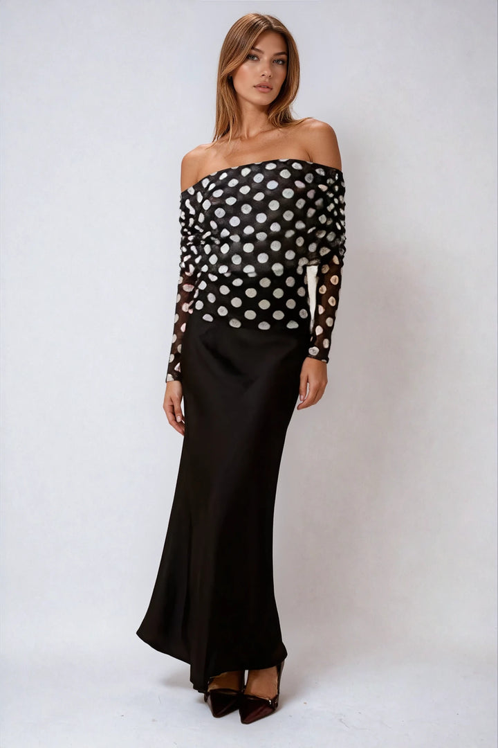 Black satin maxi skirt with high waisted fit on model