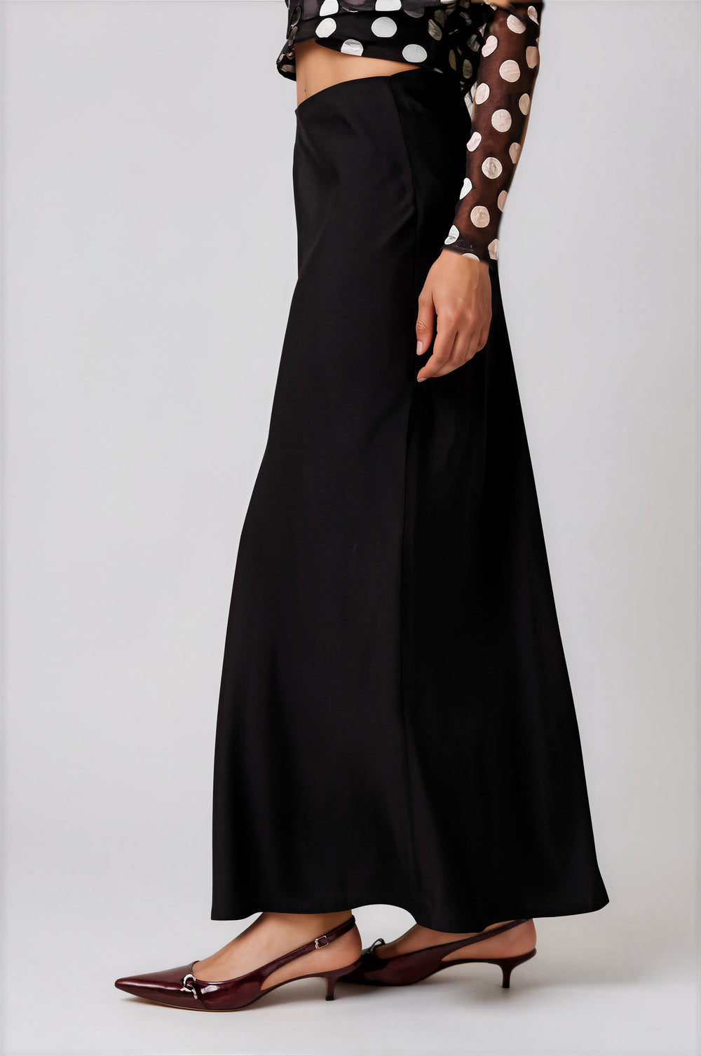 Side view black satin maxi skirt with lightweight sheen