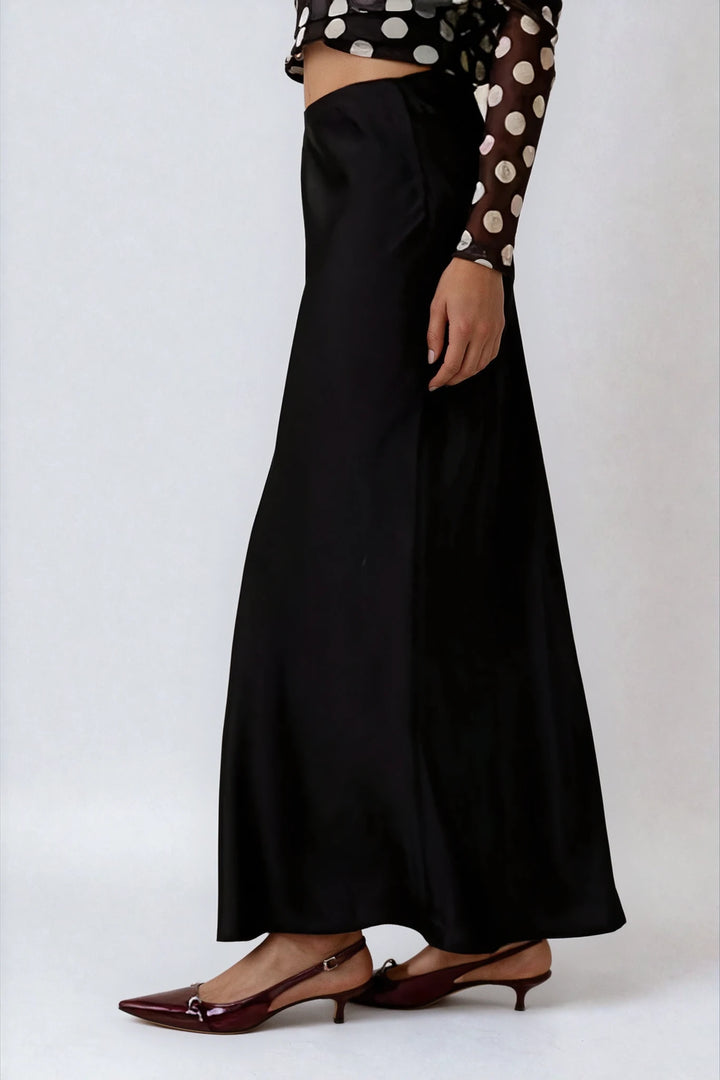 Side view black satin maxi skirt with lightweight sheen