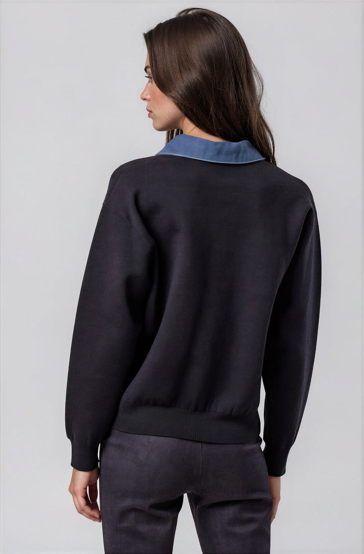 Back view navy sweater with structured neckline on model
