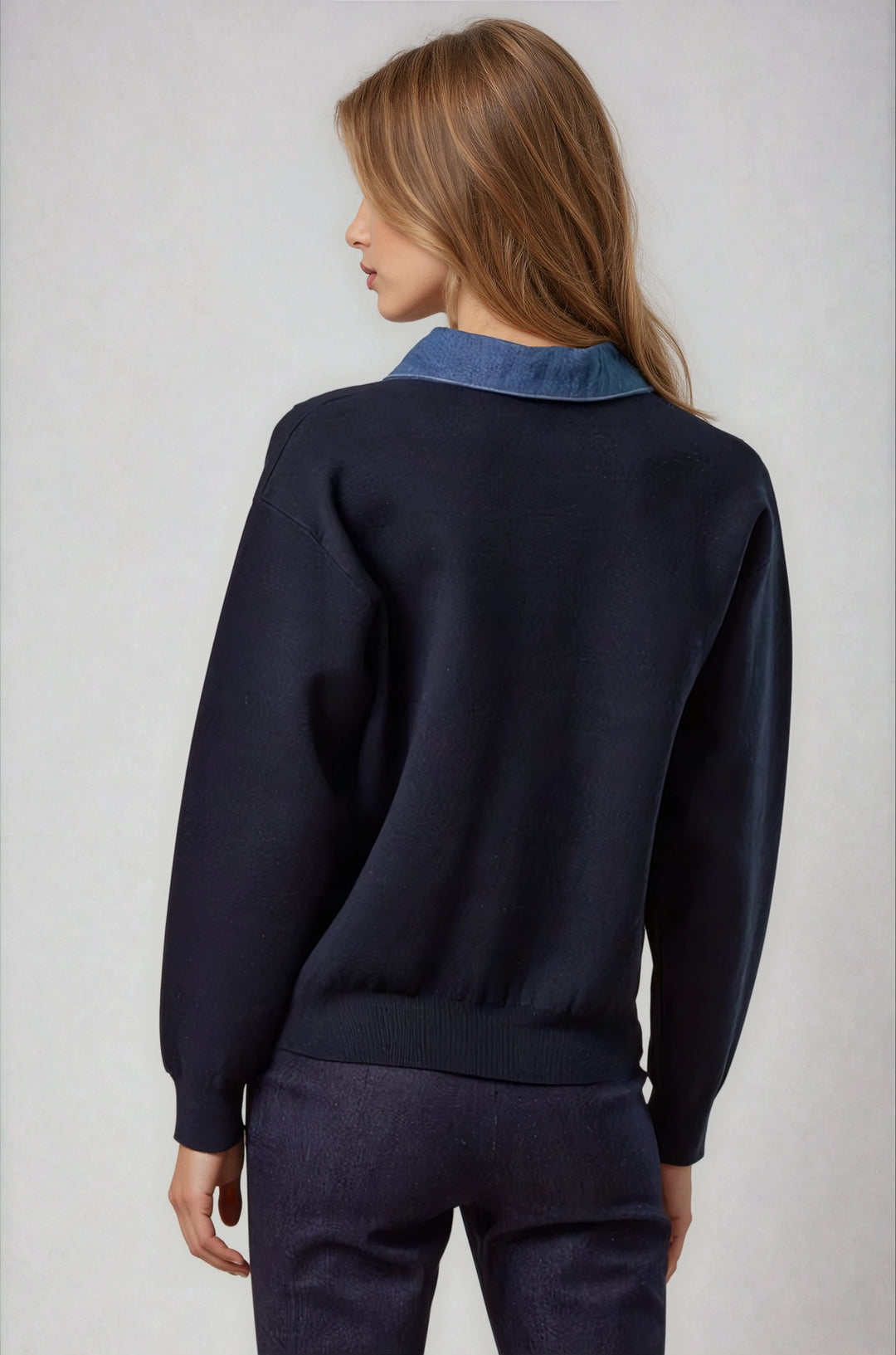 Back view navy sweater with structured neckline on model