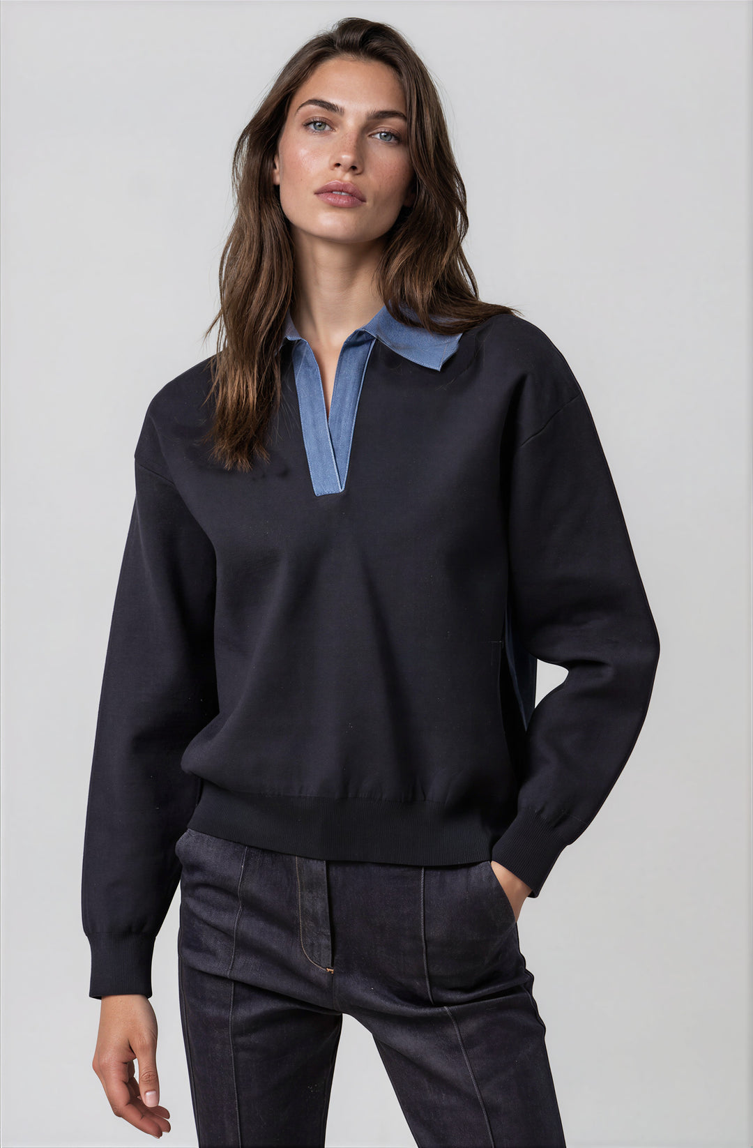 Navy knit sweater with contrasting denim collar on model