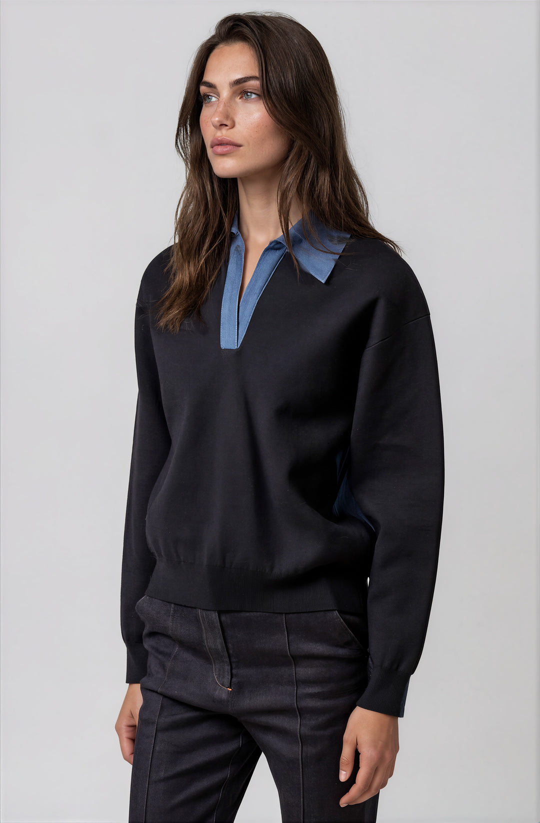 Side view navy knit sweater with relaxed silhouette
