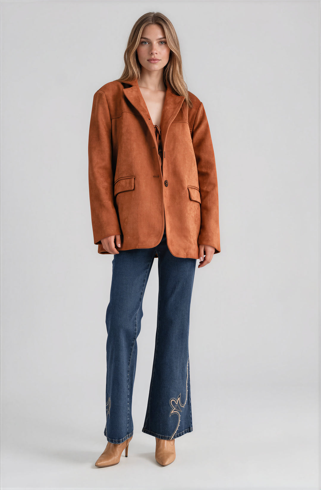 Brown faux suede blazer jacket with structured drape on model