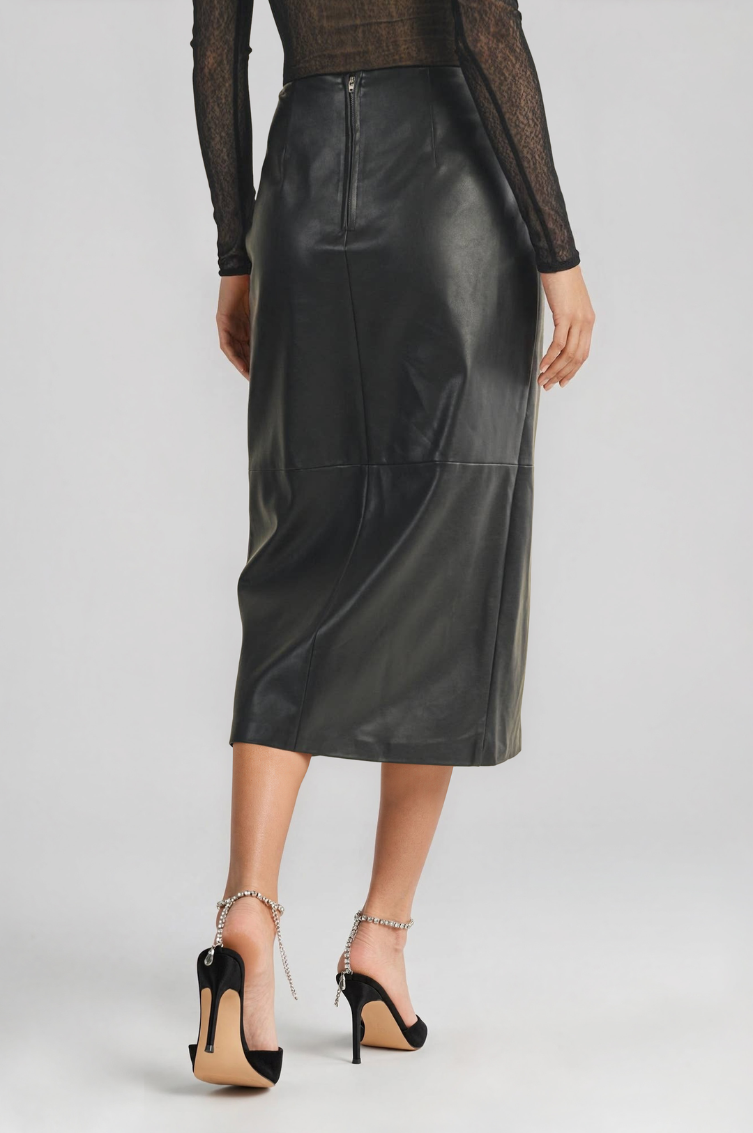Black vegan leather wrap skirt with a high front slit, detail view #color_black