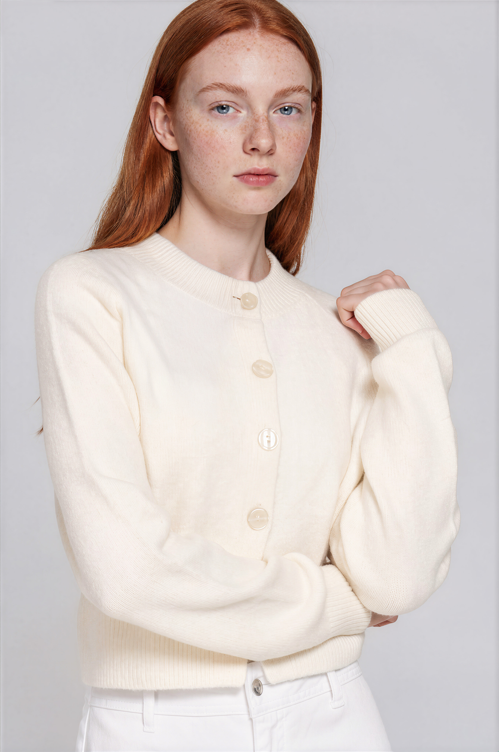 Ivory knit cardigan with a button-down front