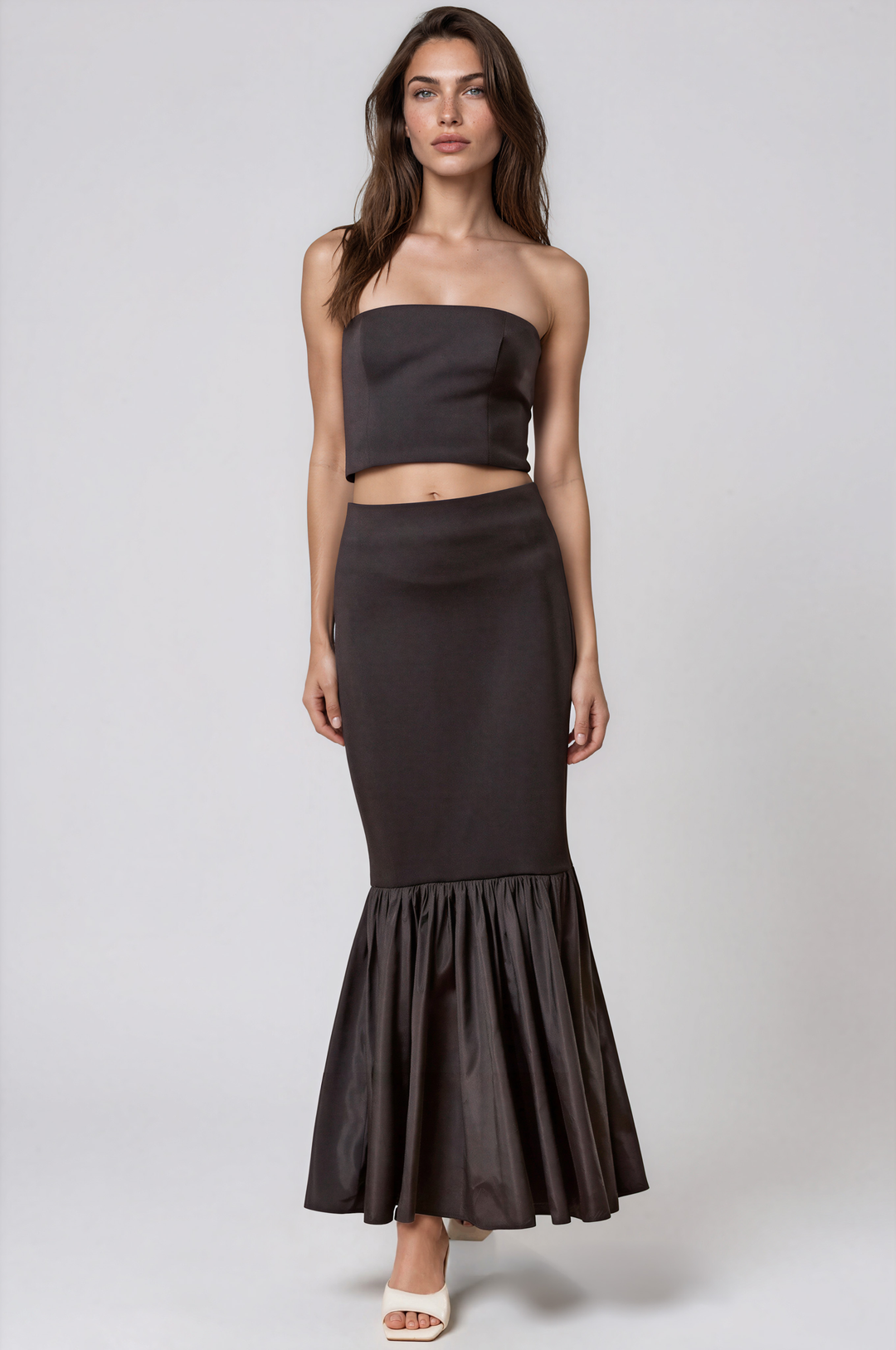 Black strapless two piece set with mermaid maxi skirt on model