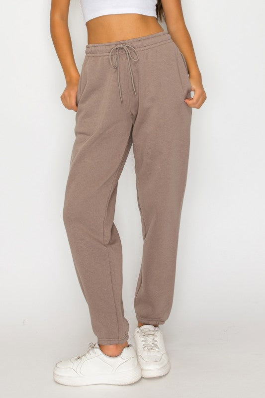 Front view taupe fleece sweatpants with drawstring waistband