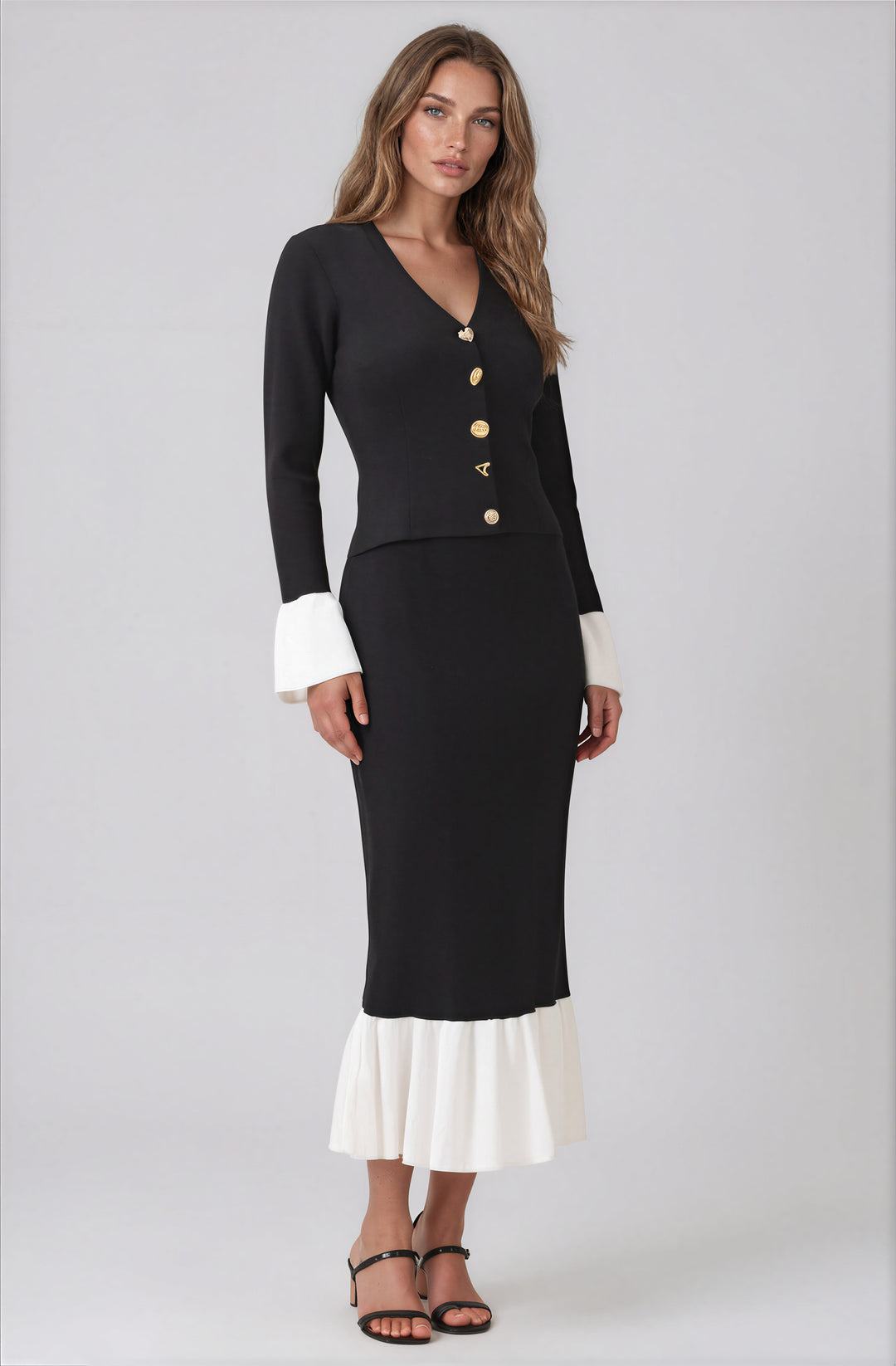 black and white matching skirt set with intricate buttons