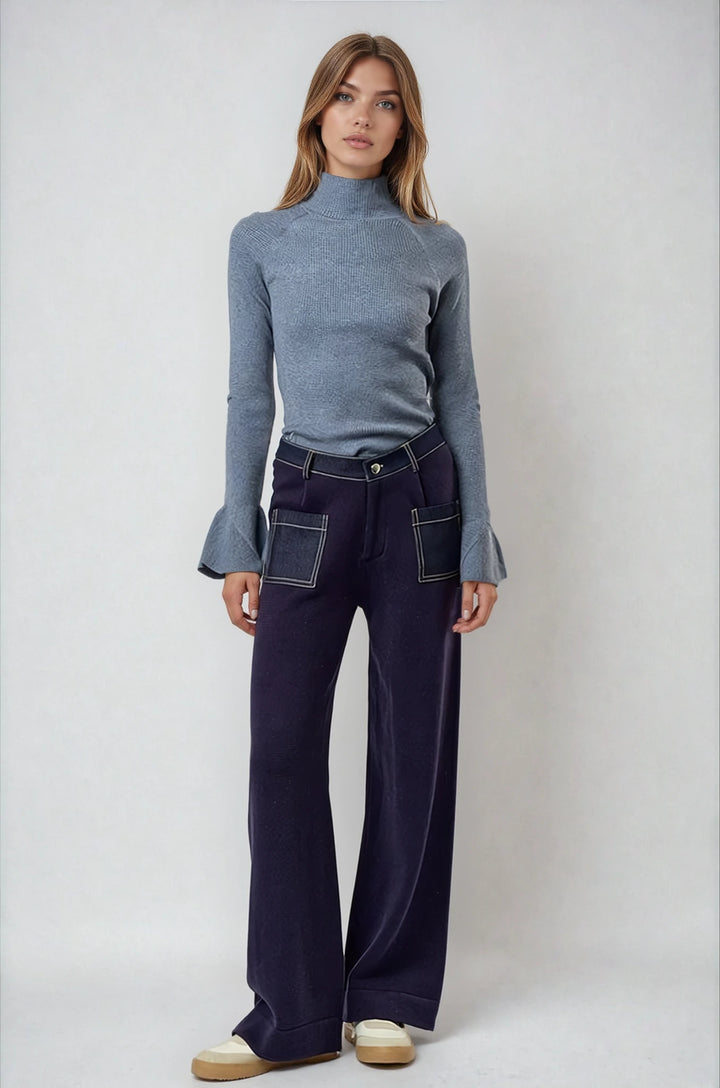 Gray ribbed mock neck sweater with tulip bell sleeves on model