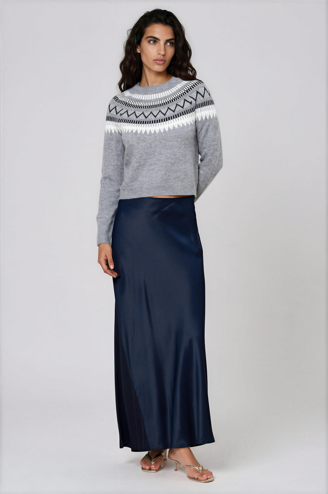 Gray patterned crewneck sweater with modern yoke on model