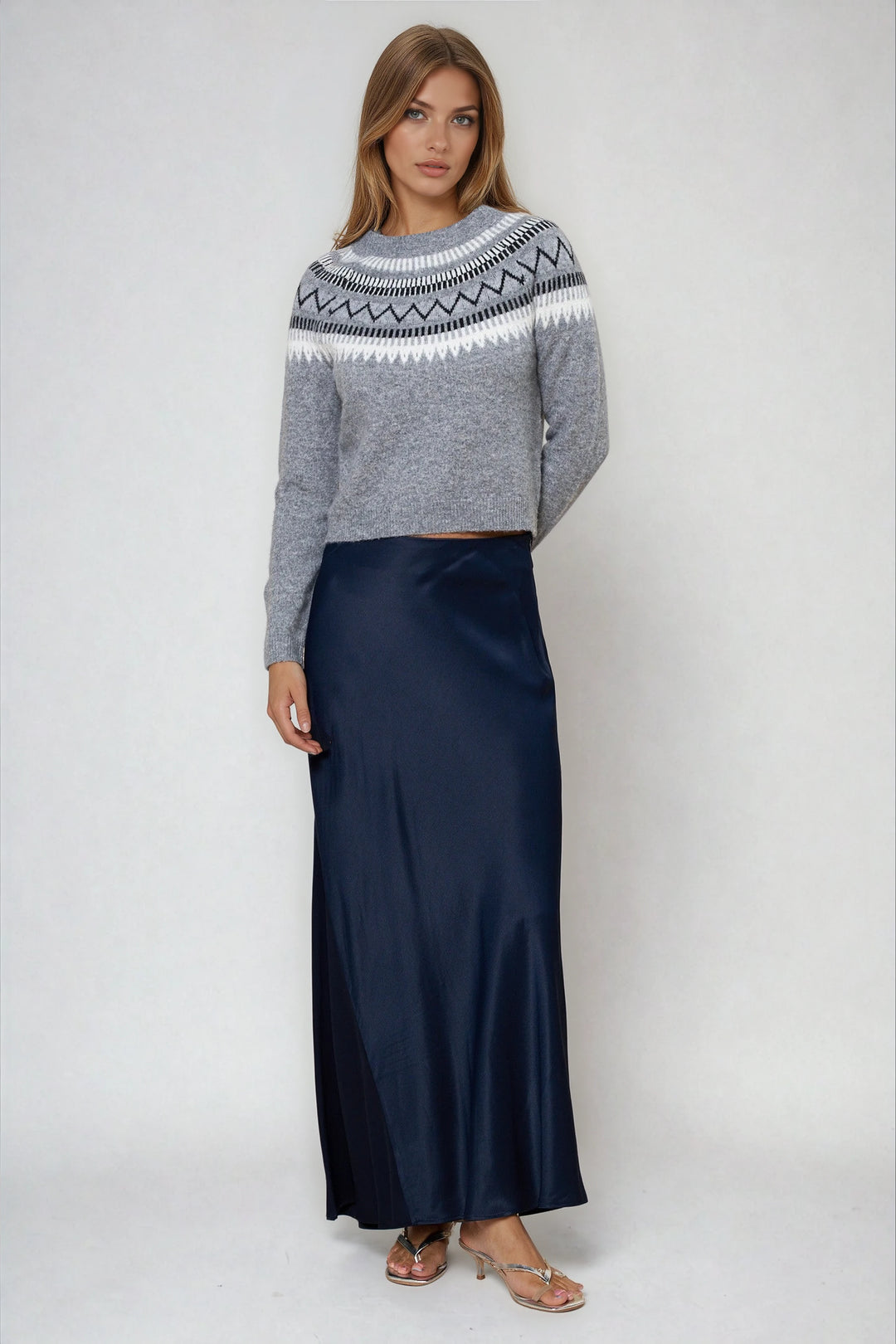 Gray patterned crewneck sweater with modern yoke on model