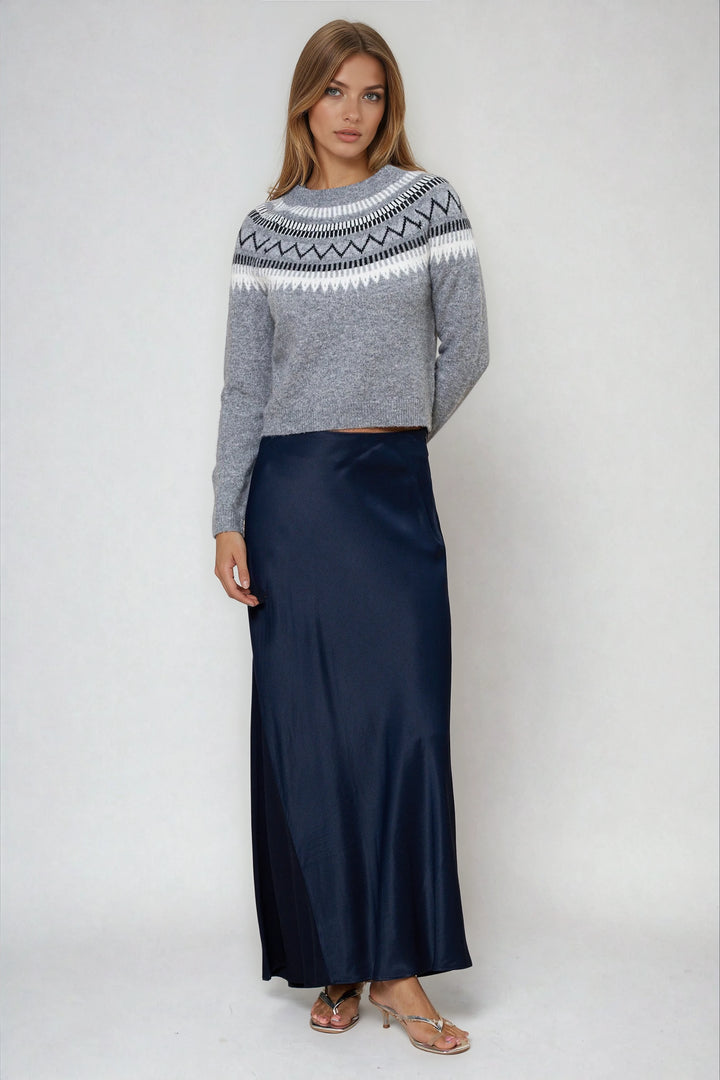 Gray patterned crewneck sweater with modern yoke on model