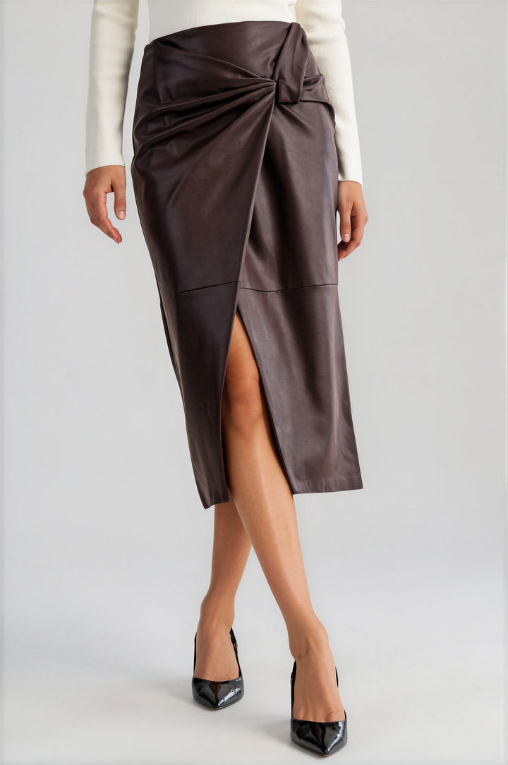 Brown vegan leather knot-front wrap skirt in a midi pencil silhouette #color_brown