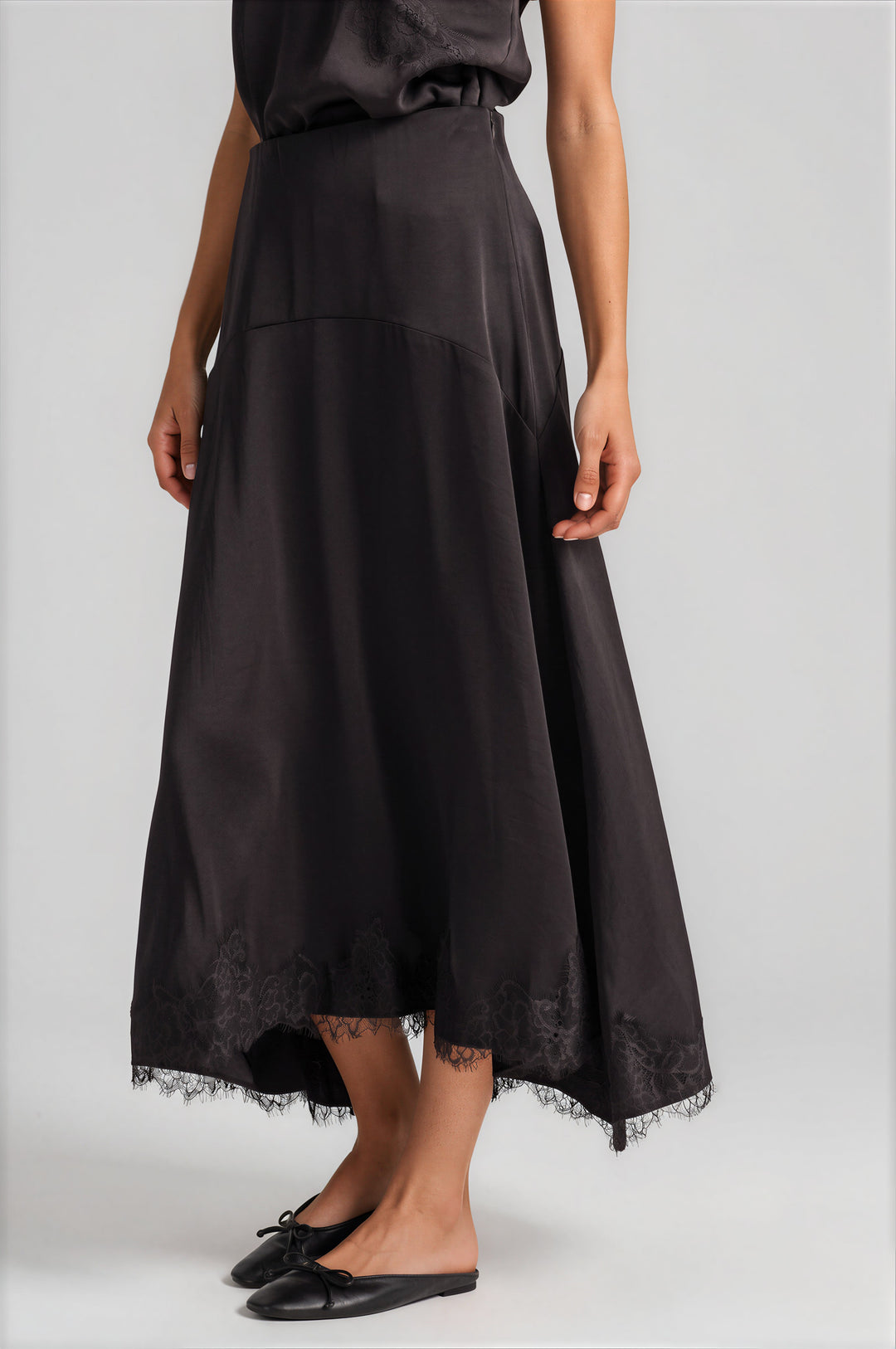 Chocolate satin slip skirt with floral lace appliqué, detail